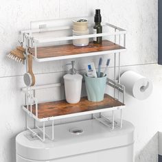 a bathroom shelf with toilet paper, toothbrushes, and other items on it