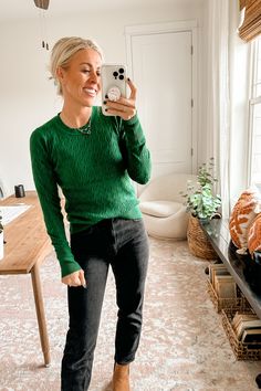 a woman taking a selfie in her living room