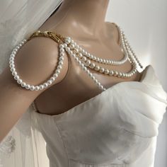 This stunning shoulder necklace is the perfect addition to your wedding dress.  I know your wedding day will be special but full of stress because there are so many things going on. Because of that I worked on this shoulder necklace for a few months to ensure that it would stay in place for the whole day, without having to worry if is falling, breaking or not looking good in the photos. There are so many shoulder necklaces on the market but none of them have the straps to attach it to your dress and avoiding falling on a side or another. This necklace will completely transform your dress making it glamorous and making you look like a goddess.  I can also modify them according to your needs. I can combine different sizes of pearls, put more or less strands, finish them with gold or silver. Shoulder Jewelry, Shoulder Necklace, Real Pearls, Gifts For My Boyfriend, Bridal Pearls, Dress Making, Pretty Dresses, Pearl Necklace, Wedding Day