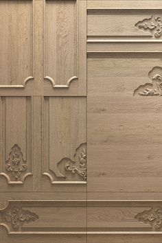 a close up of a wooden cabinet with decorative carvings on the front and side panels