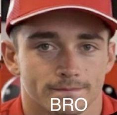 a man wearing a red baseball cap with the word bro on it in front of him