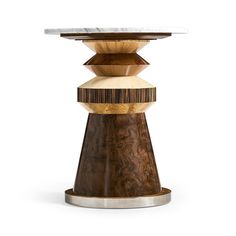 a wooden table with marble top sitting on a white surface and metal base in front of it