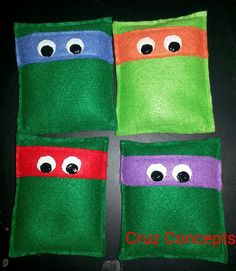 four ninja turtles made out of felt with googly eyes and one eye on each side