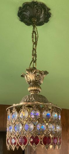 a chandelier hanging from the ceiling in a room