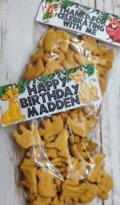 happy birthday madden cookies in plastic wrapper on white wooden table with winnie the pooh sticker