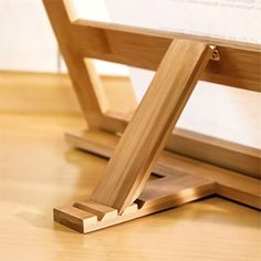 a close up of a wooden frame on the floor