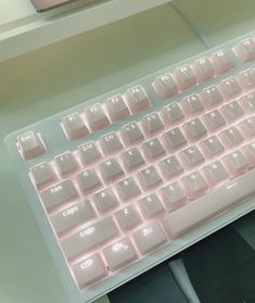 a computer keyboard sitting on top of a desk