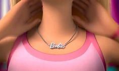 a woman with blonde hair wearing a pink tank top and necklace that says barbie on it