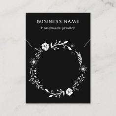 a business card with a floral wreath on it, and the words handmade jewelry