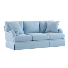 a light blue couch with pillows on the arm and back cushions that are folded down