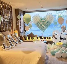 a bedroom decorated with balloons and decorations