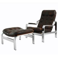 a brown leather chair and ottoman with chrome legs