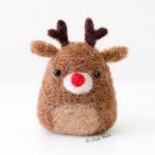 a small stuffed animal with a red nose