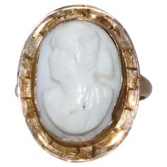 10 KT yellow gold cameo ring with unique designing. This ring is sized as 5 1/4 which could be resized if needed and is weighted 3.0 grams. The ring is hallmarked 10 K gold and has also been checked for authenticity. Gold Signet Ring With Cameo Collectible, Gold Cameo Signet Ring Collectible, Gold Oval Cameo Rings, Victorian Gold Cameo Rings, Victorian White 14k Gold Rings, Cameo 14k Gold Rings For Collectors, 14k Gold Cameo Rings For Collectors, Collectible 14k Gold Cameo Rings, Gold Cameo Rings For Anniversary