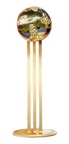 a gold trophy with three golden sticks sticking out of it's sides and the number one on each side