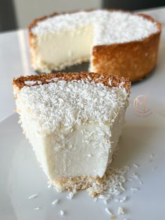 a piece of coconut cake on a white plate