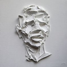 a piece of paper that has been made to look like a man's face