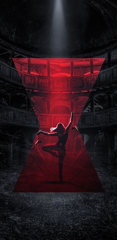 a woman is dancing in the middle of a dark room with red light coming from behind her