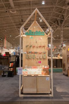 the inside of a store with wooden displays