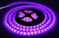 purple led strip light on black background