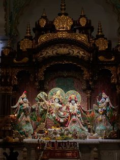 an ornate shrine with statues and decorations