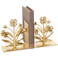 two bookends with flowers on them sitting next to each other