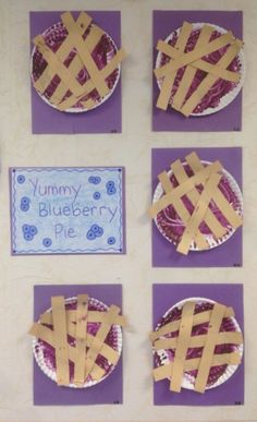 four pieces of paper are taped together to make pies on purple plates with words written in them