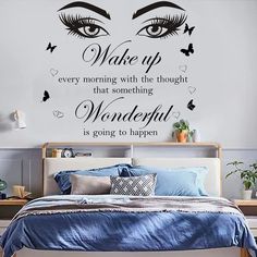 a bedroom with a large wall decal that says wake up every morning with the thought that something wonderful is going to happen