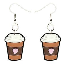 two cupcakes with hearts on them are hanging from silver earwires,