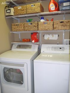 a washer and dryer sitting next to each other in a room with shelves