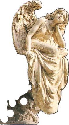 an angel statue sitting on top of a pedestal