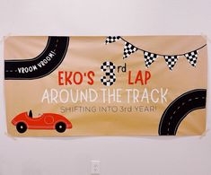 a sign hanging on the side of a wall that says expo's 3rd lap around the track