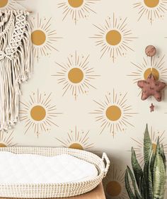 the wallpaper in this room has sunbursts on it, and is gold