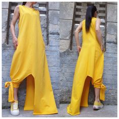 "Casual summer sleeveless yellow dress with side pocket . The asymmetrical length on one side is long to the ankle and on the other side is tied to the leg🤩 Extravagant designs and high quality fabrics. The item from the pictures is size S For more information feel free to ask questions. Material &Care Cotton and elastane Machine wash 30oC Hand wash at low temperatures Do not machine dry Medium hot iron Sizing We make sizes from xs to 5xl as well as customized measures.So don't hesitate to cont Sleeveless Asymmetrical Dress With Side Slits, Summer Maxi Dress With Side Slits And Asymmetrical Hem, Spring Sleeveless Asymmetrical Dress With Side Slits, Yellow Asymmetrical Maxi Dress For Summer, Yellow Sleeveless Asymmetrical Dress For Spring, Fitted Yellow Asymmetrical Summer Dress, Yellow Fitted Asymmetrical Summer Dress, Yellow Asymmetrical Summer Dress, Fitted Yellow Asymmetrical Sleeveless Dress