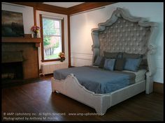 a bedroom with a bed and fireplace in it