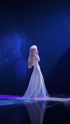 a woman in a white dress is standing on a blue stage with her hands behind her head