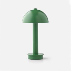 a green table lamp on a white background