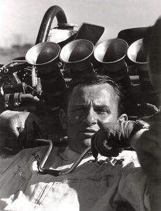 black and white photograph of man with gas masks on his head