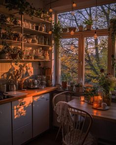 a kitchen filled with lots of pots and pans on top of a stove top oven