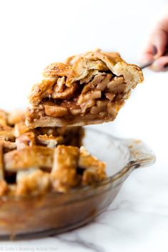 a close up of a pie in a dish with a spoon sticking out of it