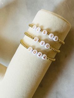 Celebrate a date! Wear your favorite number, wedding date, your child's birthday or sports number with these 18k gold filled beaded number bracelets. Gold filled beads are much more tarnish resistant and long lasting opposed the the more commonly seen gold plated. Size options for girls and women. These bracelet layer well with others so add this to your stack! Beaded on high quality stretch cord and secured. -  4mm 18k gold filled beads       acrylic number letters -  Enter your numbers in pers Number Bracelets, Date Bracelet, Date Wear, Number Jewelry, Number Beads, Favorite Number, Bracelet Wedding, Anniversary Dates, Gold Number