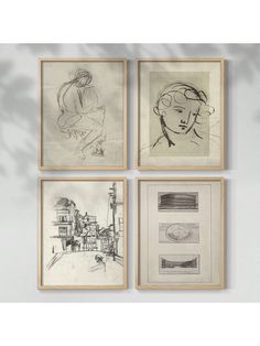 four drawings are hanging on the wall