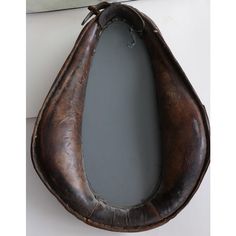 an old leather shoe hanging on the wall