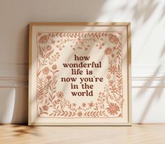 a framed print with the words how wonderful life is now you're in the world