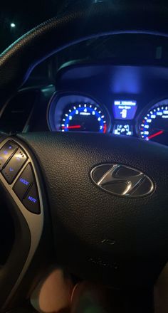 the interior of a car with dashboard lights and gauges