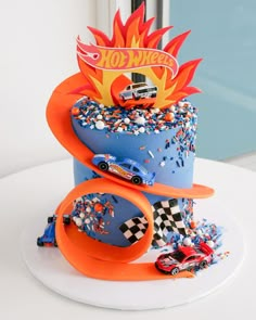 a birthday cake with cars on top