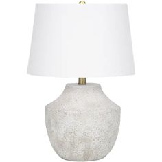 a white table lamp with a gold base and a white linen shade on the top