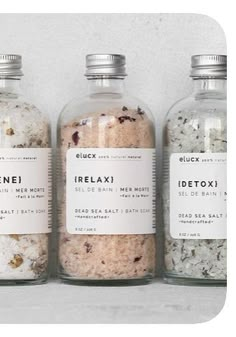 three jars filled with different types of bath salts