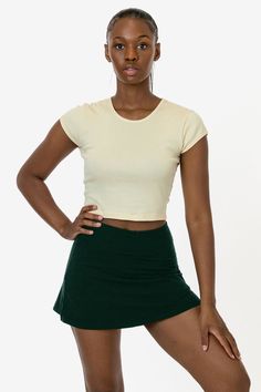 The Garment Dye Cheer Skort is made of our premium heavyweight cotton spandex and features a mid to high waist fit. This style features full, fitted shorts underneath so you can move around freely and a minimal 1/2" elastic waistband. Try pairing this skirt with a matching crop top or bodysuit for an athletic and sporty inspired look that shows off your figure. 2 side slits to this mini skort add a flirty finish. Made in Los Angeles, Calif. Our experienced sewers earn up to $25 an hour and no le Cheer Shorts, Skort Style, Fitted Shorts, Los Angeles Apparel, La Outfits, Comfortable Skirts, Pretty Shorts, South Central, Long Torso