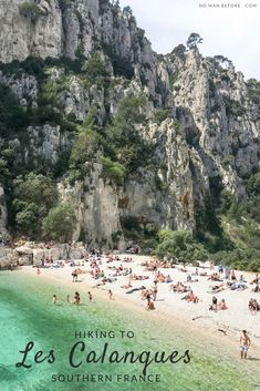 people are relaxing on the beach in front of some mountains and cliffs with text reading hiking to les calanques southern france